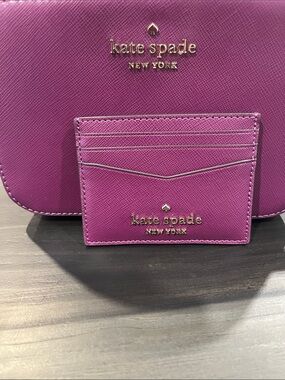 Kate Spade purse and card holder.  Purple/Plum with gold logo on both.